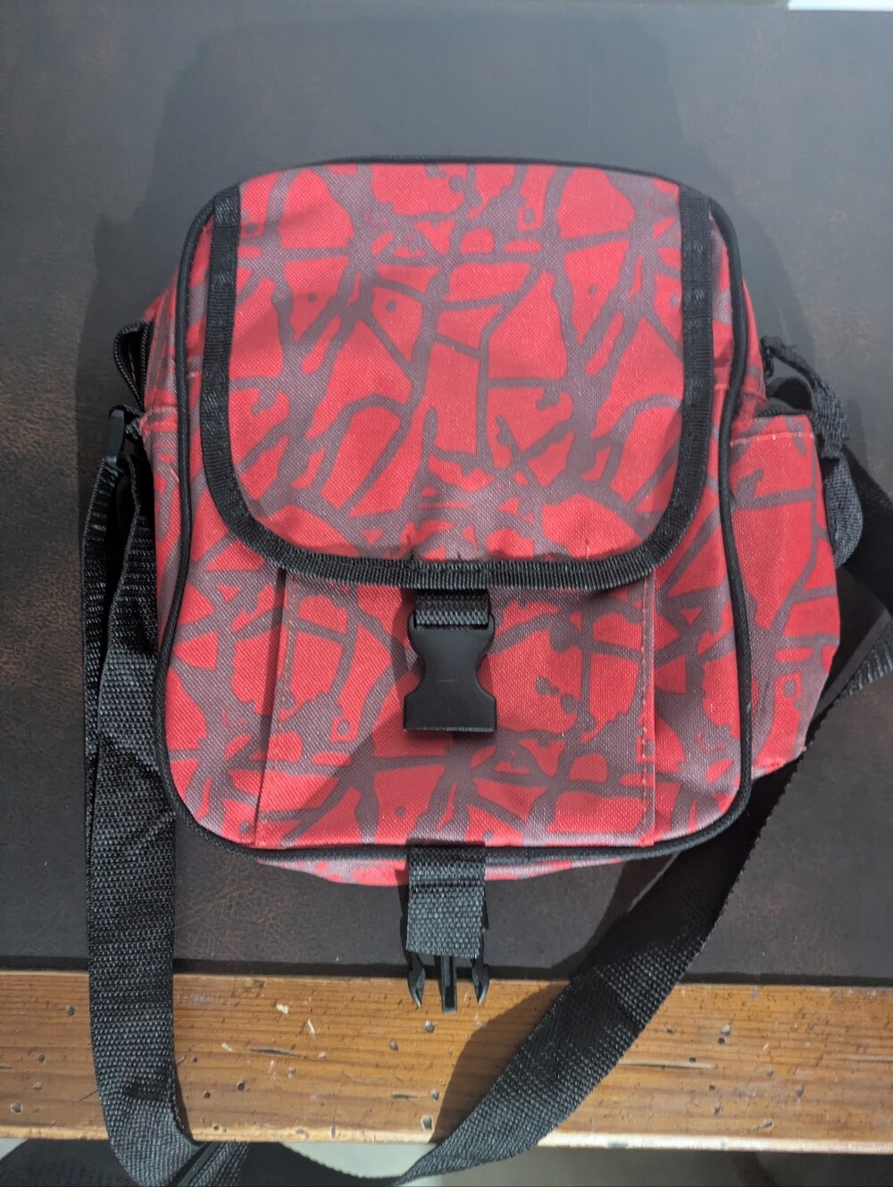 Red Patterned Men's Messenger Bag with Black Trim